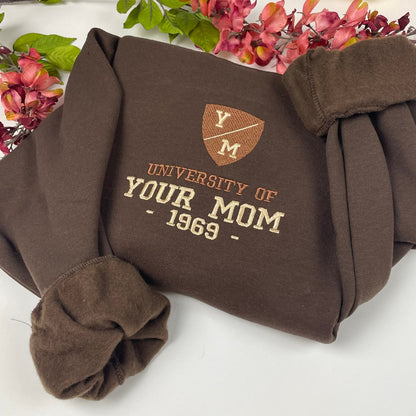 Unisex sweatshirt with "University of Your Mom 1969" embroidered design.