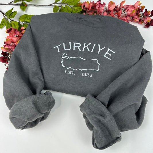 Turkey embroidered sweater with 'Turkiye' text and map design on front, made of polyester and cotton blend fabric.