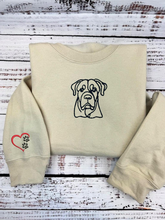 Custom dog embroidered hoodie with outlined dog design and heart paw sleeve decoration.