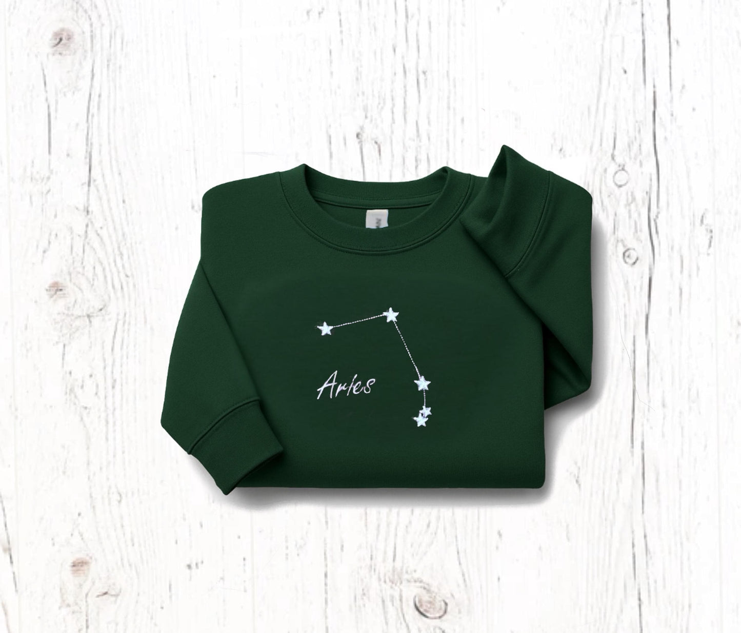 Custom Zodiac Constellation Embroidered Sweatshirt in green with Aries star sign design.